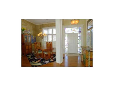 Gorgeous stained glass windows surround entry door