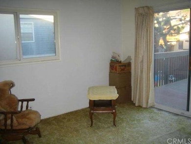 Upstairs Bedroom with Sliding Door Access to Rear 