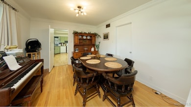 THE FORMAL DINING ROOM OPENS INTO THE KITCHEN.