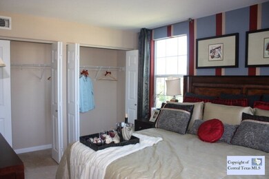 Large master bedroom with sliding closet doors and