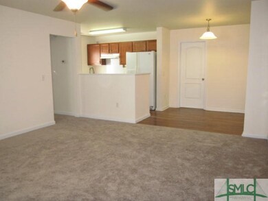 Living room open to the kitchen and breakfast area