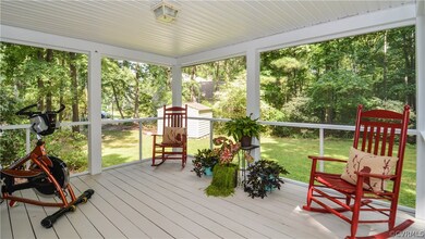 Freshly painted screened back porch overlooking a