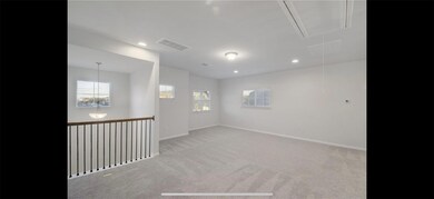 Spare room featuring attic access, light colored 