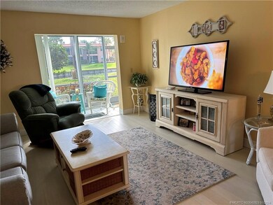 Living area open to glassed in porch