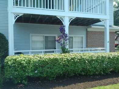 Fenced patio with double sliders to living room an