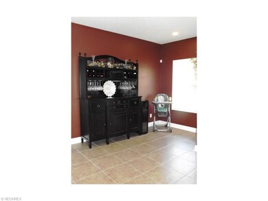Sitting area in kitchen. Room for a coffee couch.