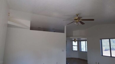 Living room looking into kitchen bright+