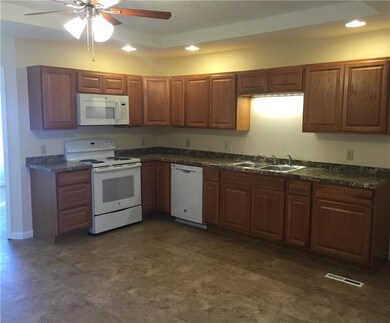Kitchen Dining: stove and microwave. Beautiful cou