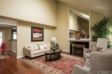 Formal living room features high ceiling & 4-panel