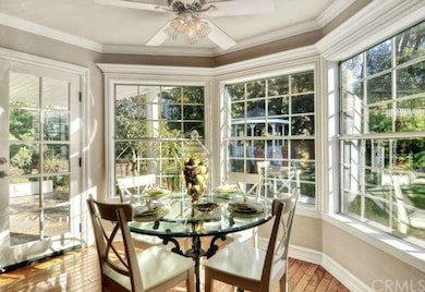 Walls of windows surround this great eating nook w