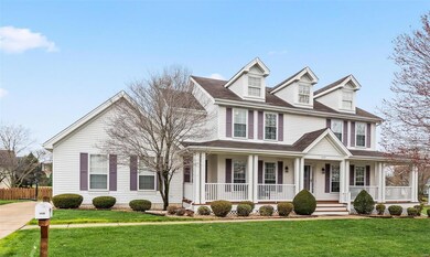 Home includes gorgeous landscaping and amazing wra