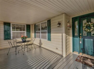 FRONT PORCH IS LARGE ENOUGH FOR ENTERTAINING YOUR GUESTS OR RELAXING.