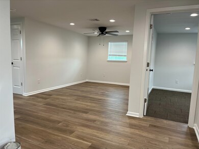 Looking into living room and Primary bedroom on the right