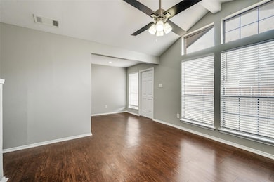 Spare room with ceiling fan, visible vents, a weal