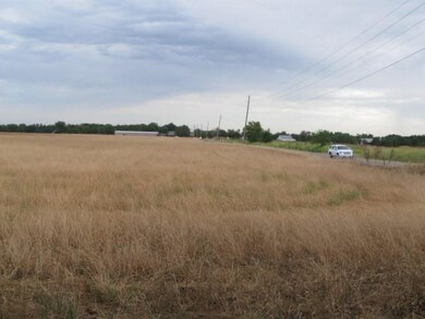Looking N across the open field and N Kickapoo Ave