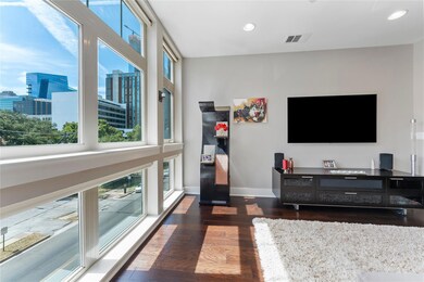 Living area featuring recessed lighting, a city v
