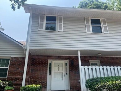 Entrance to property with brick siding