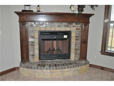 Living Room. Stunning fireplace with brick and sto