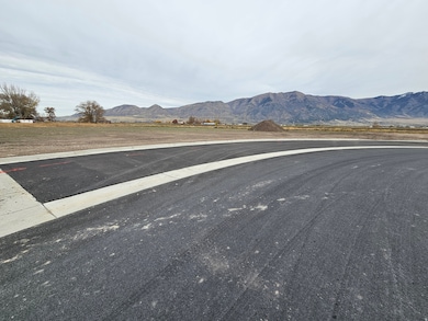 View of asphalt road featuring a mountain view