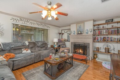 Living room with light hardwood / wood-style floor