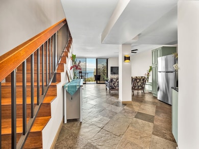Bright and welcoming this gorgeous unit boasts elegant slate flooring downstairs and strand bamboo steps and flooring upstairs. The open concept  floor plan allows for versatility. All are drawn to the stunning views from the spacious lanai!