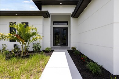 View of exterior entry featuring french doors and