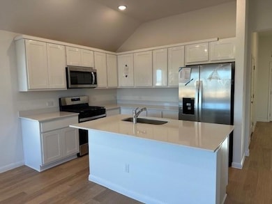 Kitchen featuring stainless steel appliances, woo