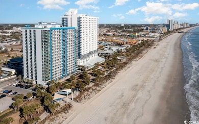 Aerial view featuring a view of city, a beach view
