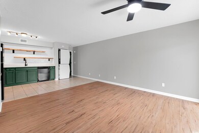 Unfurnished living room featuring track lighting, 