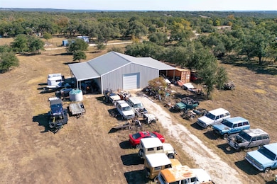View of subject property featuring a forest