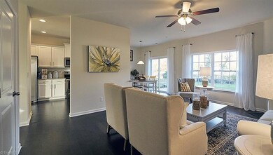 Living room & entrance to kitchen.