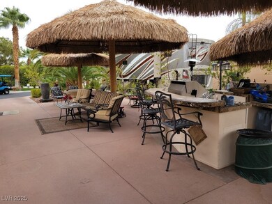 View of patio featuring an outdoor kitchen and a g