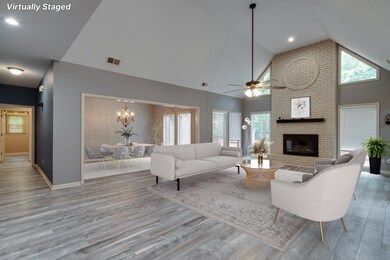 Living room featuring ceiling fan with notable cha