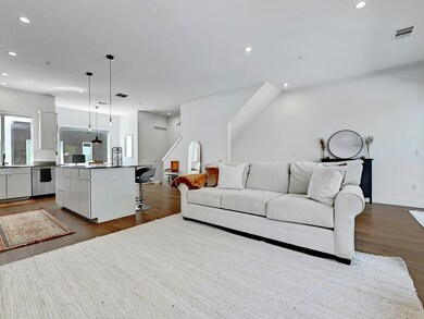 Living area featuring dark wood-type flooring, vi