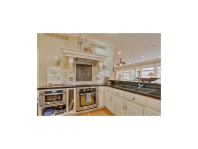 Open Kitchen has Hardwood Floors, Granite Counters