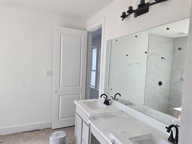 Main Bath with dual vanities and knee space