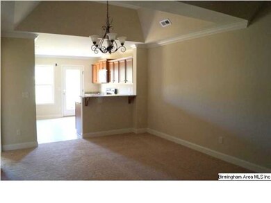 Dining Room has trey ceiling and upscale fixture