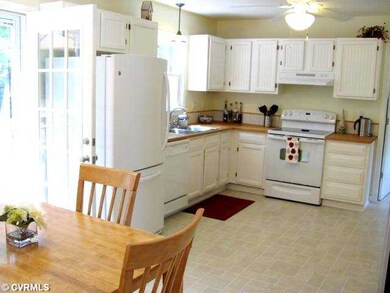 Kitchen - Adorable Kitchen has White Cabinets, But