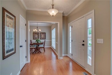 The entry foyer is 10' x 6' with hardwood floors, 2 coat closets, crown molding and ORB drop light.  