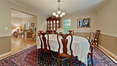 Formal dining room with chair rail and crown moldi