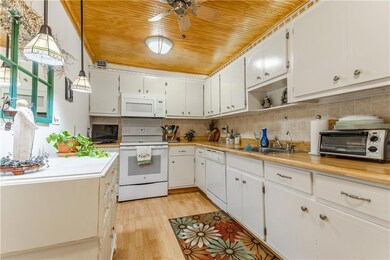Kitchen:) Note custom tongue N groove wood ceiling