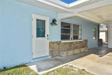 Doorway to property featuring stucco siding