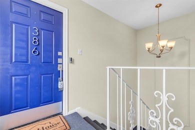 Step into unit 386 through a bold, updated blue fr