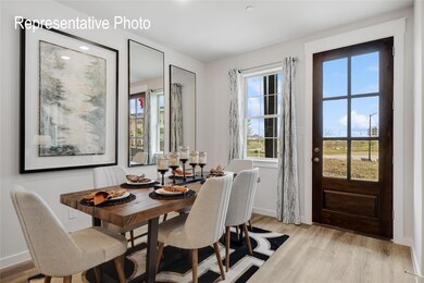 Dining space with light hardwood / wood-style flooring