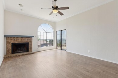 Unfurnished living room featuring a fireplace, woo