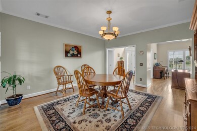 Formal dining has access to double doors to the ba