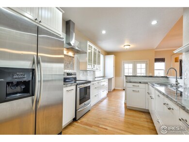 Vent hood, tile backsplash, tumbled edge counters.