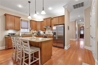Kitchen has lots of cabinets plus a wide pantry on