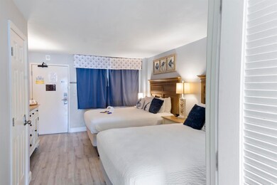 Bedroom featuring light wood-style floors and baseboards