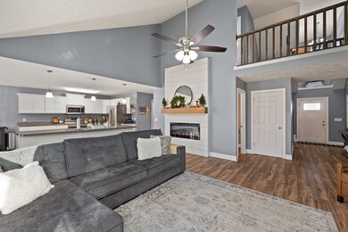 Living Room open to Upstairs Hallway